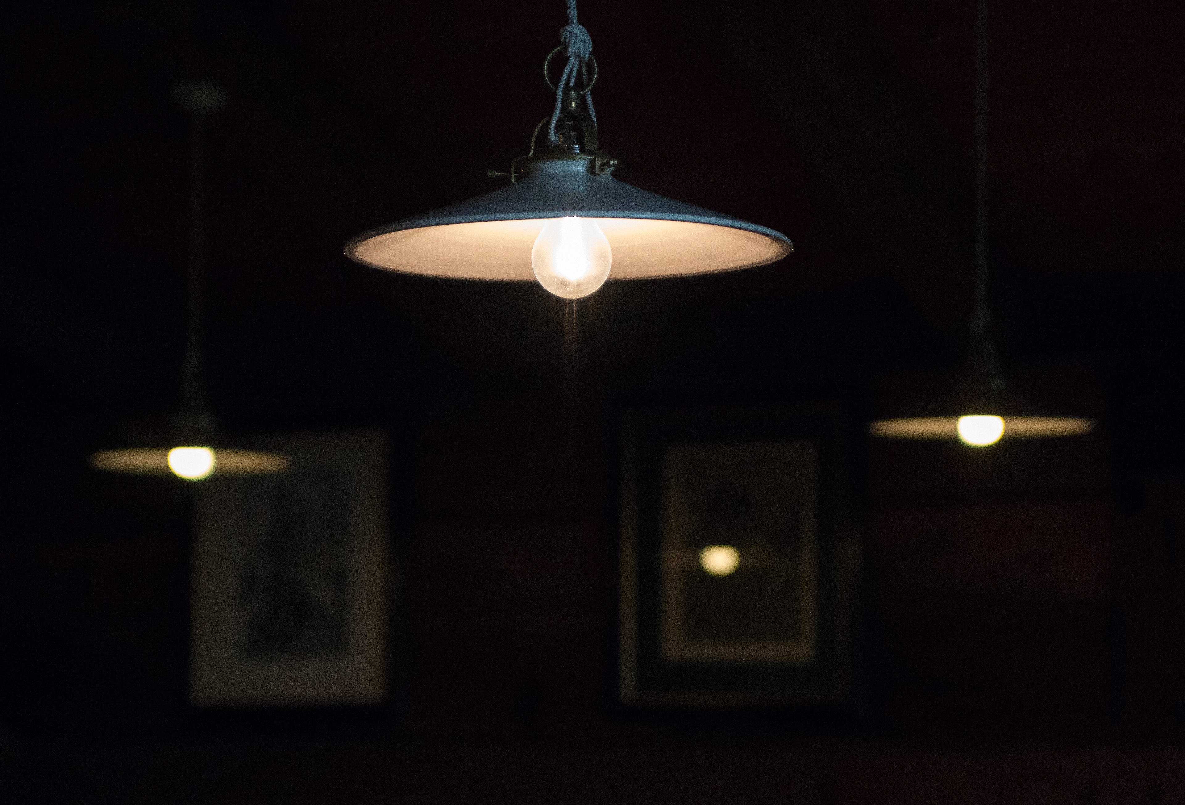 Pendant lamps glowing in a dark room
